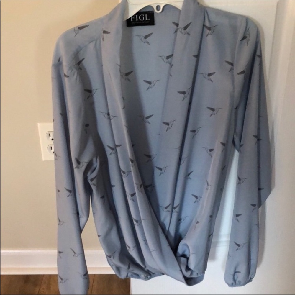 Light blue blouse.. never worn..accepting offers!